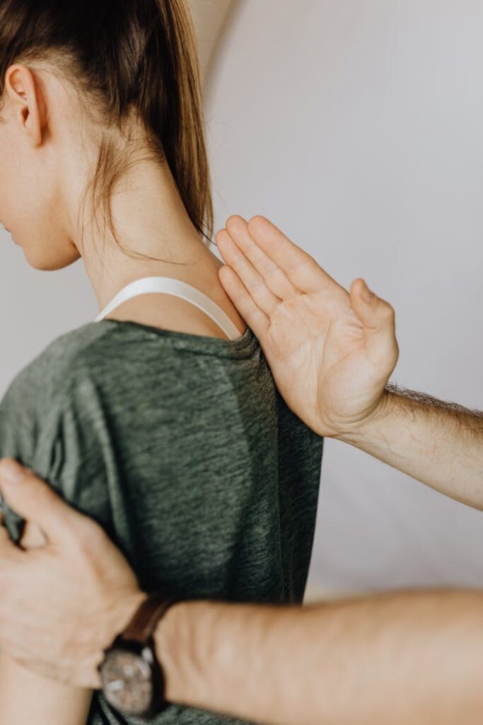 pexels-photo-4506076 Side view of crop unrecognizable orthopedist in wristwatch examining anonymous woman in casual clothes in doctor office in hospital